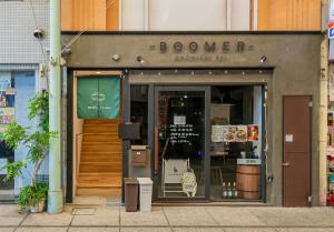 a storefront of a store with the door open at HOTEL Itsuki in Onomichi
