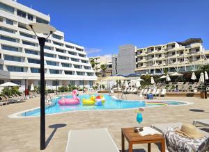 a swimming pool with inflatables in a resort at סי סייד אילת - Sea Side Eilat in Eilat