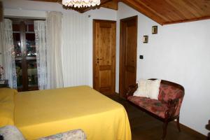 Postelja oz. postelje v sobi nastanitve Albergo Martinet