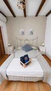 a bedroom with a bed with a tray on it at Alojamientos Rurales La Codosera in La Codosera +32 photos