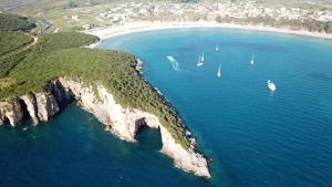an aerial view of a beach with boats in the water at Casa Rosa Ammoudia in Ammoudia +2 photos