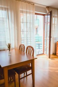 a dining room with a wooden table and chairs at Apartmány Nový Svět in Třeboň II