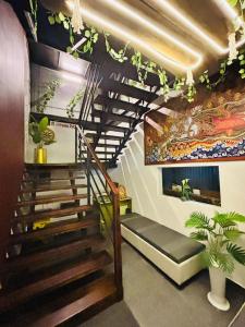 a spiral staircase in a room with a stair case at Restara Tower in Cochin +1 photo