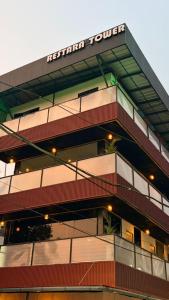 a building with a sign on top of it at Restara Tower in Cochin