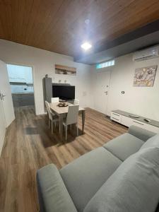 a living room with a couch and a table at Luma Sixty nine in Alcamo +21 photos