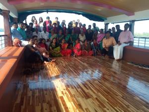 a group of people posing for a picture on a boat at Ezhimala cruise in Nīleshwar