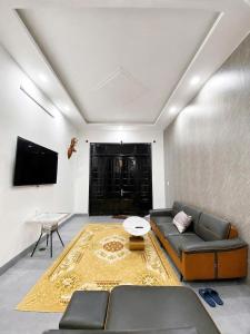 a living room with a couch and a tv at Mubee Homestay in Hue +21 photos
