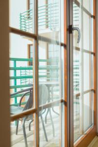 a view of a table and chairs through a window at Apartmány Nový Svět in Třeboň II
