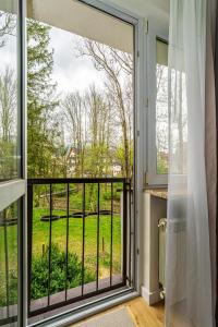 a window with a view of a yard at Apartament Flow Tatry in Zakopane