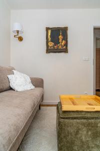 a living room with a couch and a table at Apartament Flow Tatry in Zakopane