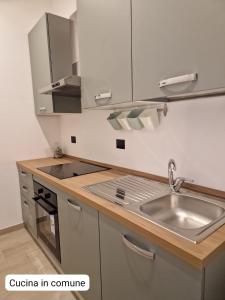 a kitchen with a sink and a counter top at Da Zia Gina Locazione Turistica in Bisceglie