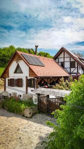a house with solar panels on top of it at Casa ISEHEIA in Sibiel