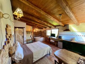 a bedroom with a large bed and a bathroom at Xalet De Prades in Prades +189 photos