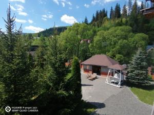 an aerial view of a gazebo in a forest at Chalet Zolota Pidkova&River 1 in Slavske