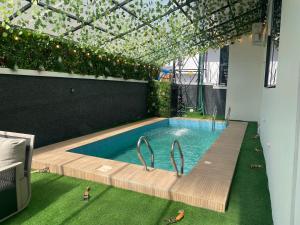a swimming pool in the middle of a house at Luxury 5 BR Villa with Pool,Cinema Lekki in Lekki