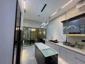 a kitchen with a sink and a counter top at Luxury 5 BR Villa with Pool,Cinema Lekki in Lekki
