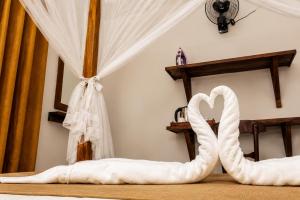 a bedroom with a bed with a heart shaped mattress at Villa Serene Herbs Dickwella in Dickwella +67 photos