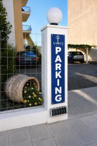 a sign for a parking garage with a barrel at 4keys House - Apartment 4 in Tripoli