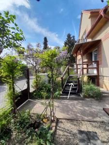 a stairway leading to a building with a fence at Hrnčírna in Kněževes