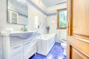 a bathroom with a sink and a tub and a toilet at Private Parking & Garden -Luxury B&B-700mt Tower in Pisa +40 photos
