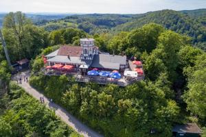 an aerial view of a house with a lot of cars at Hercynia Lodge in Bad Lauterberg