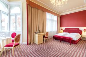a hotel room with a bed and a desk at Aviano Boutique Hotel in Vienna +68 photos