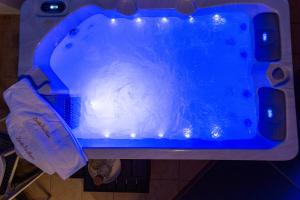 a blue tub filled with water in a room at Zante Pantheon Hotel in Tsilivi