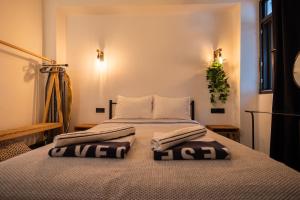 a bedroom with a bed with two pillows on it at 62 HOME in Marmaris +9 photos
