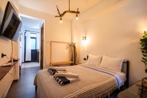 a bedroom with a bed with towels on it at 62 HOME in Marmaris
