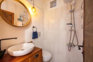 a bathroom with a sink and a toilet and a mirror at 62 HOME in Marmaris