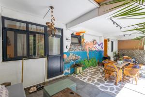 a living room with a table and a painting on the wall at 62 HOME in Marmaris