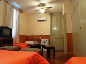 En eller flere senger på et rom på Hotel Casablanca Montevideo