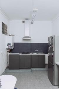 a kitchen with a refrigerator and a sink at ArtHause in Gubin