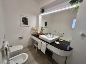 a bathroom with a sink and a mirror at Mareluce in Letojanni +43 photos