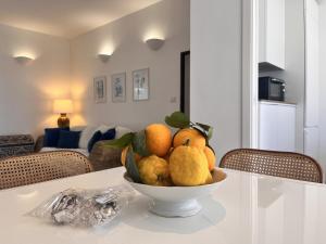 a bowl of fruit on a table in a living room at Mareluce in Letojanni