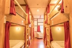 a room with four bunk beds in a room at Nikko Park Lodge Tobu Station in Nikko