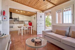 a living room with a couch and a table at Villa Javier in Torrox