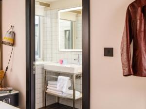 a bathroom with a sink and a mirror at ARK Shoreditch in London