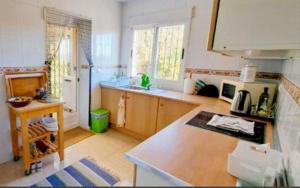 a kitchen with a sink and a counter top at Casa Elletofft in Puerto de Mazarrón