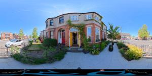 a large brick house on a city street at Avoca House in Dublin