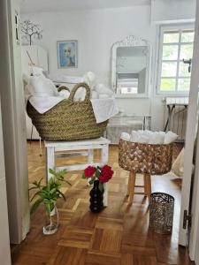 a room with two baskets on a wooden floor at Bed in mixed room of 3 to 4 or private room for 3 to 4 in Zizur Mayor