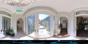 a room with a hallway with a view of a balcony at Avoca House in Dublin