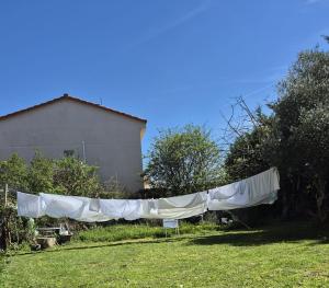 a clothes line in the yard of a house at Bed in mixed room of 3 to 4 or private room for 3 to 4 in Zizur Mayor +4 photos