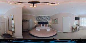 a bedroom with a bed in the middle of a room at Avoca House in Dublin +17 photos