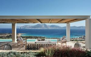 a patio with a view of the ocean and mountains at Koufonisi Villa Kallisti in Koufonisia