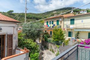 a view from the balcony of a house at Le Cote di Seccheto - Goelba in Seccheto