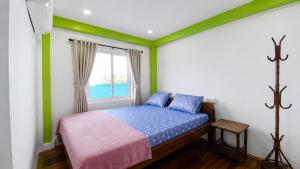 a bedroom with a bed and a window at Villa Koh Rong in Koh Rong Island