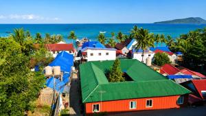 an aerial view of a town with a green roof at Villa Koh Rong in Koh Rong Island