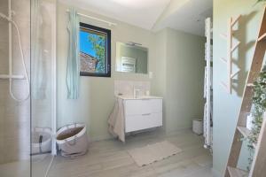 a bathroom with a sink and a shower at Le Logis des Abeilles in Lapenne +17 photos