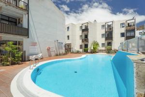 a swimming pool in the middle of a building at Casa Perla in Playa de Santiago